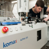 Komax reduziert Stellen