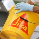 Sika schliesst Verkauf von Industriebeschichtungs-Geschäft ab
