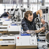 Komax und Schleuniger: Durch Fusion Spitze bleiben